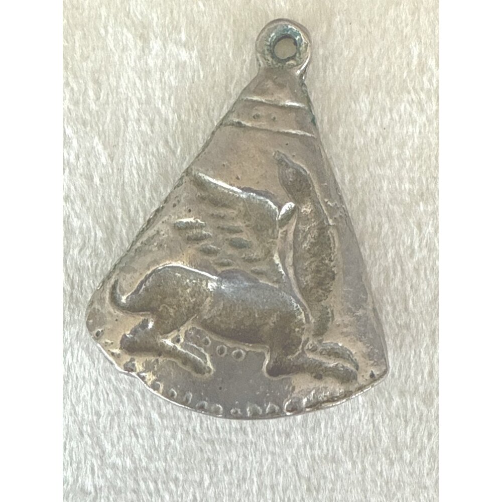 Vintage Triangular Silver-Tone Pendant With Engraved Winged Creature Design